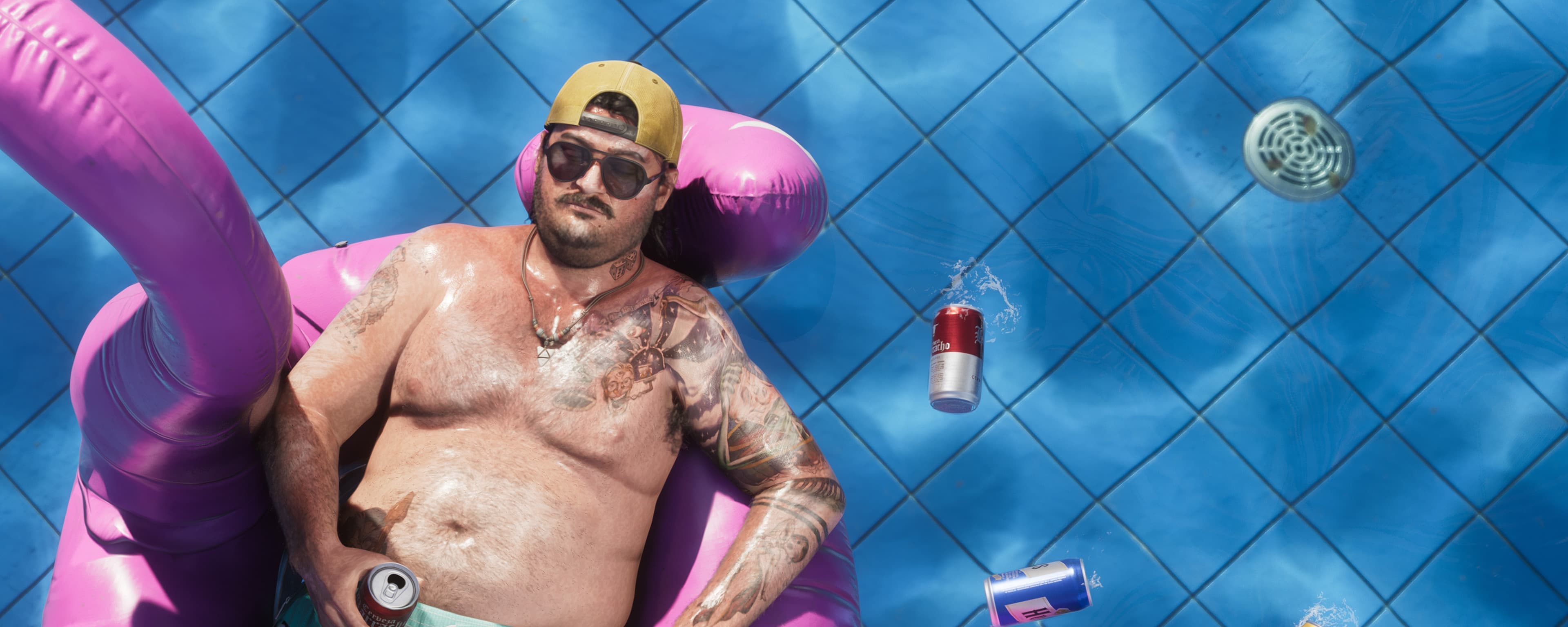 A man floating in a pool on a flamingo float